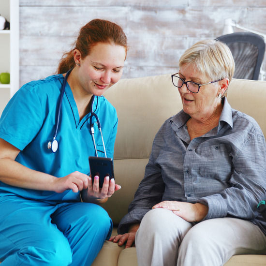 Registered nurse reviewing a patient care plan at home